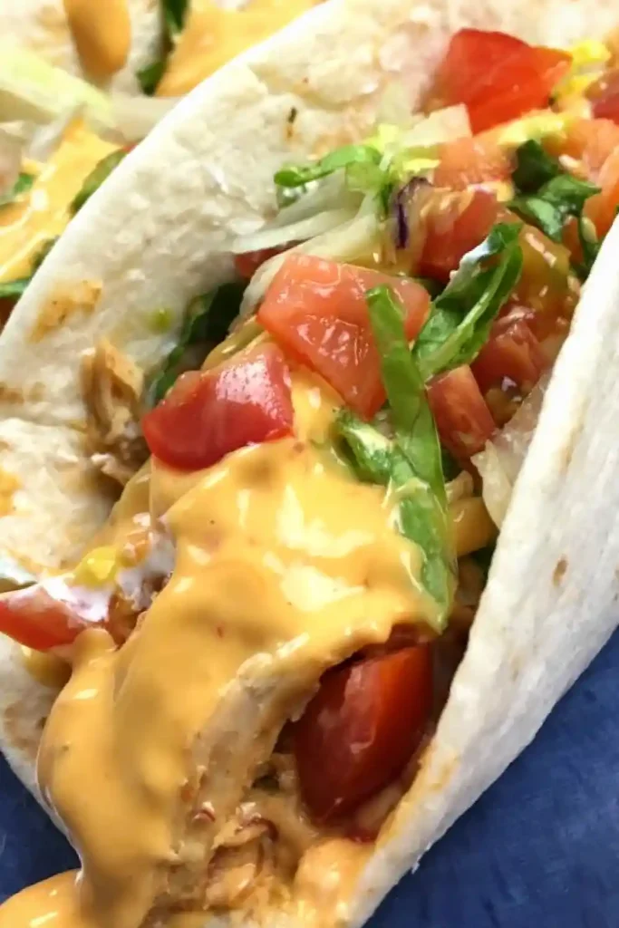 Slow Cooker Queso Chicken Tacos